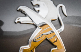 ep filed - 06 march 2017 hessen darmstadt an opel logo is reflected in a peugeot logo on the hood of