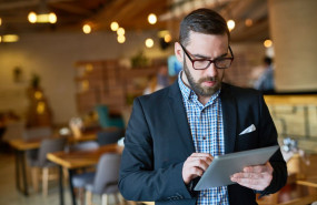 1626679384 bearded manager using digital tablet