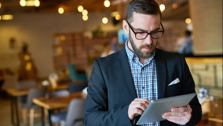 1626679384 bearded manager using digital tablet