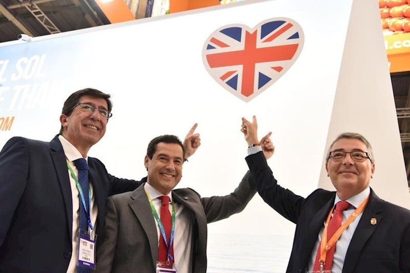 ep juan marin en un acto en la world travel market junto a juanma moreno