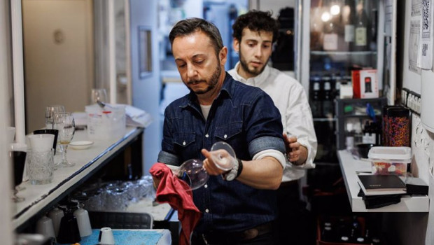 ep archivo   un camarero limpia una copa de vino a 20 de abril de 2022 en madrid espana