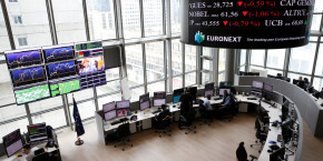 traders work at their desks in a trading room at the stock market operator euronext headquarters in la defense business and financial district in courbevoie near paris 