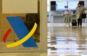 ep archivo   logotipo de la agencia tributaria en una mampara en una oficina de dicha agencia en
