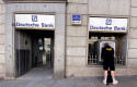 ep archivo   un hombre retira dinero de un cajero deutsche bank en madrid espana a 7 de febrero de