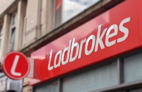 dl entain ladbrokes coral gambling bookies shop sign