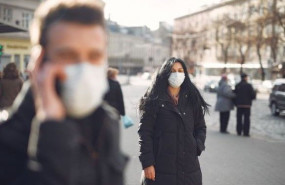 1586161582 canva woman in black coat and face standing on street 1586161582 canva woman in black coat and face standing on street