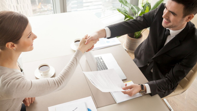 1654094100 business partners celebrating contract signing