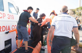 ep 20 august 2019 italy lampedusa a woman evacuated by the guardia costeria for a medical emergency