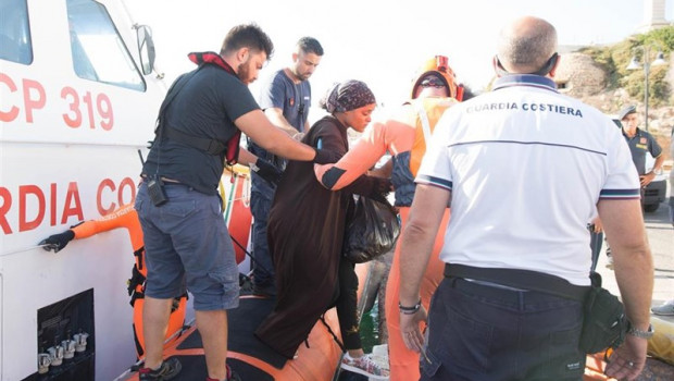 ep 20 august 2019 italy lampedusa a woman evacuated by the guardia costeria for a medical emergency