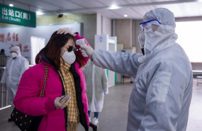 ep 10 february 2020 china jiangsu a doctor uses a forehead digital thermometer to measure the body ep 10 february 2020 china jiangsu a doctor uses a forehead digital thermometer to measure the body